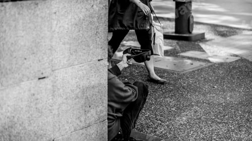 Preview: A beggar holding his cap to collect change
