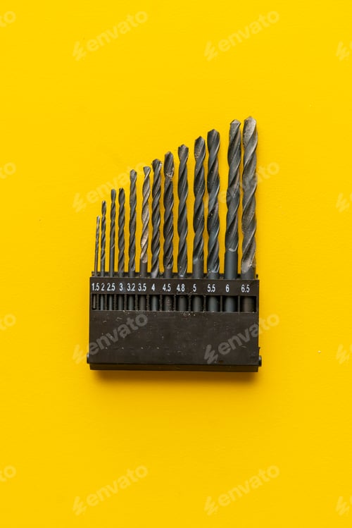 Preview: drill bits kit on the colordul surface isolated, equipment dor a repairman