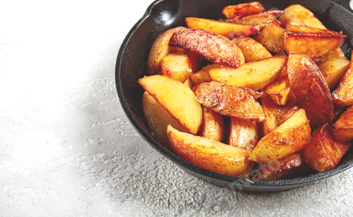 Fried Potato Wedges in a Cast Iron Skillet