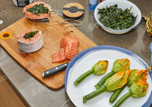 Preview: Salmon with spinach and zucchini flowers and sauce. French gourmet cuisine