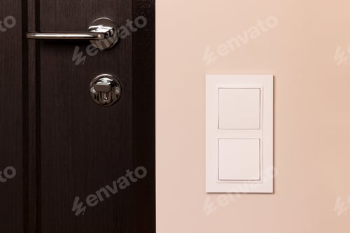 Preview: White electrical switch on beige wall