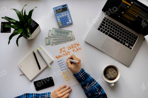 Preview: Financial Planning on a White Desk with Laptop