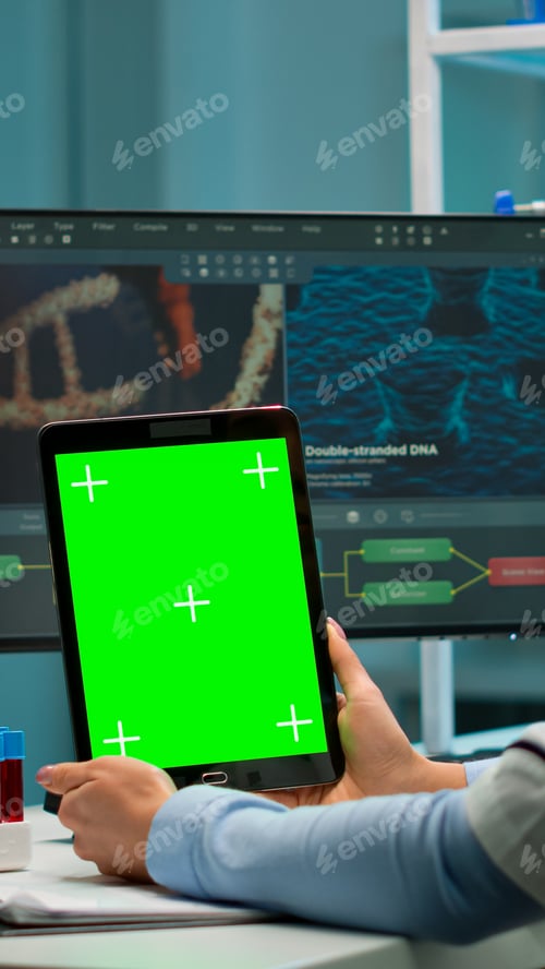 Preview: Scientist holding tablet with green chroma key screen