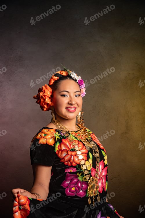 Preview: A woman in a colorful dress with a flower headpiece is smiling for the camera