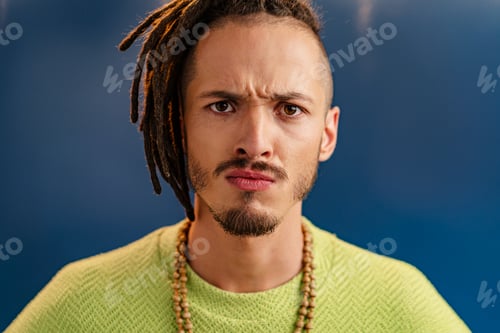 Preview: Close-up portrait of a young stylish man with dreadlocks