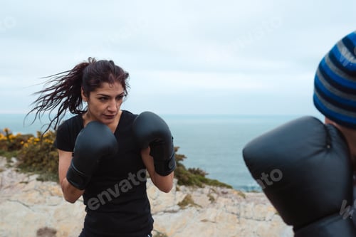 Preview: Boxers exercising on cliff