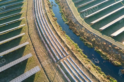Preview: Aerial view of large sustainable electrical power plant with rows of solar photovoltaic panels