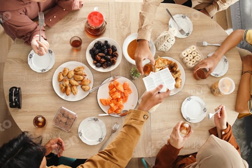 Preview: Muslim People Enjoying Iftar Food During Breakfasting