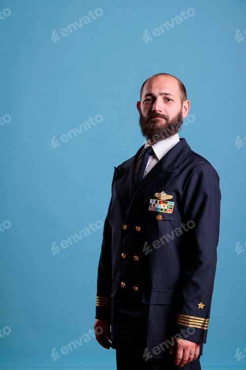 Preview: Airplane captain standing in professional uniform portrait