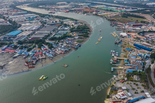 Preview: Aerial view of a cargo ships carrying and transporting huge containers through the river