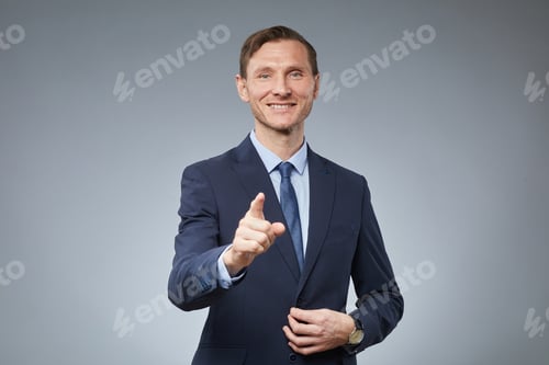 Preview: Smiling Businessman Pointing at You