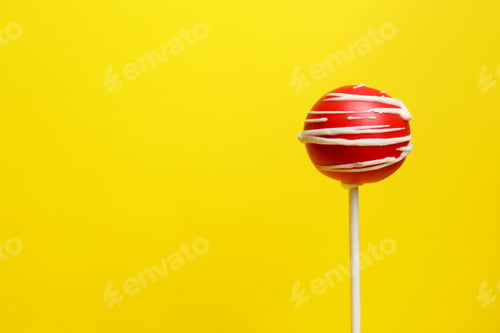 Preview: Bright delicious cake pop on color background. Space for text