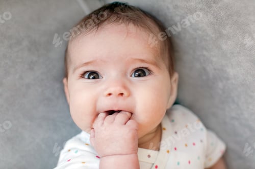 Preview: Funny baby biting fingers