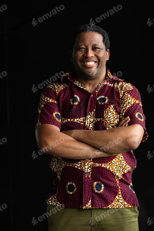 Preview: Portrait of handsome black man smiling with arms crossed