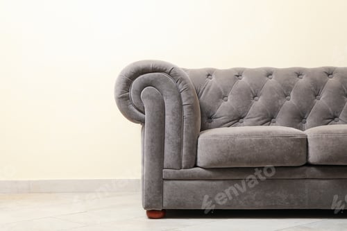 Preview: Simple interior with sofa against light beige wall