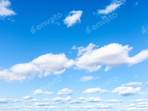 Preview: blue sky with white cumulus clouds on sunny day