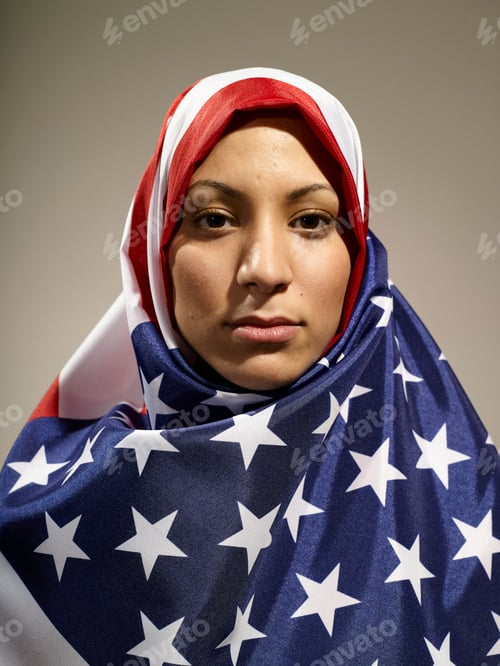 Preview: A woman draped in an American flag-patterned hijab gazes directly at the camera