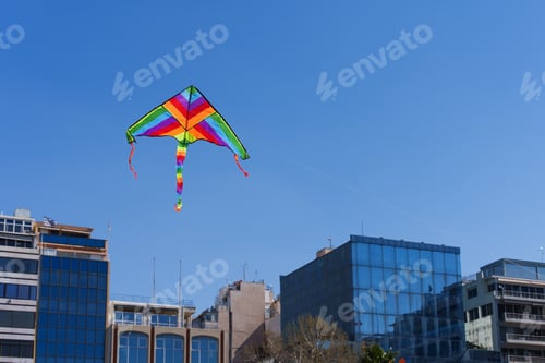 Preview: Colorful kite soars high in the sky Blue sky. Sports kite festival.