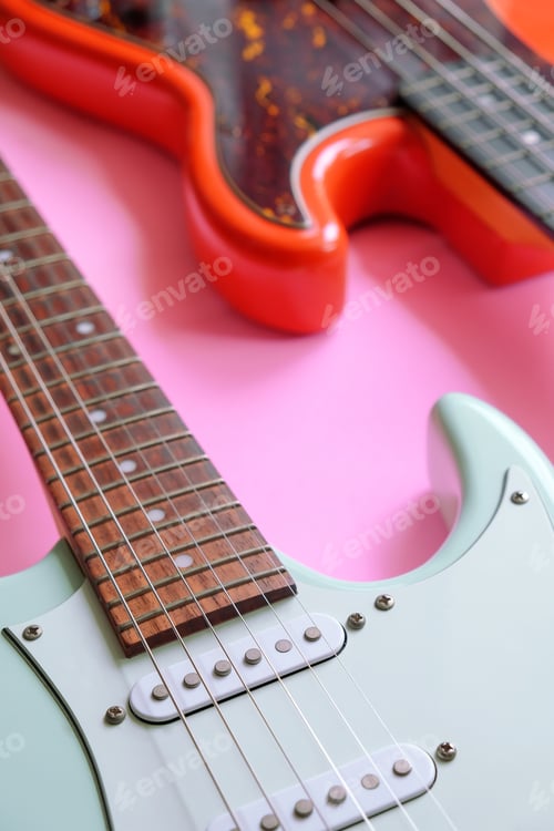 Preview: Electric guitar and bass guitar on a pink background