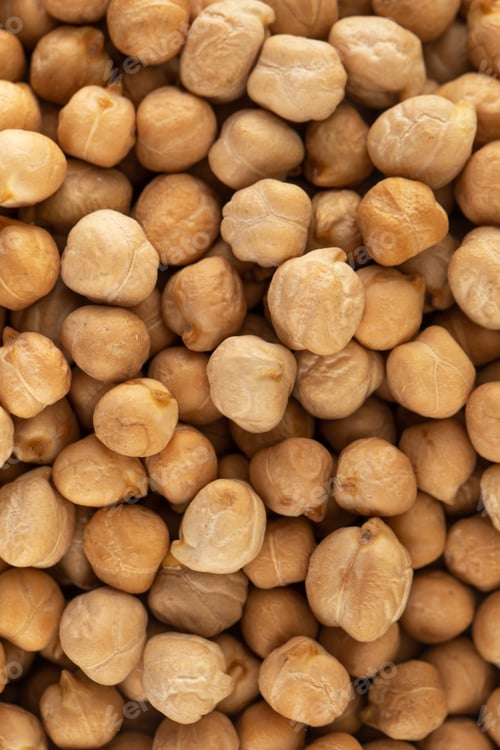Preview: Raw chickpeas in full frame. The concept of vegetable protein. Horizontal frame.