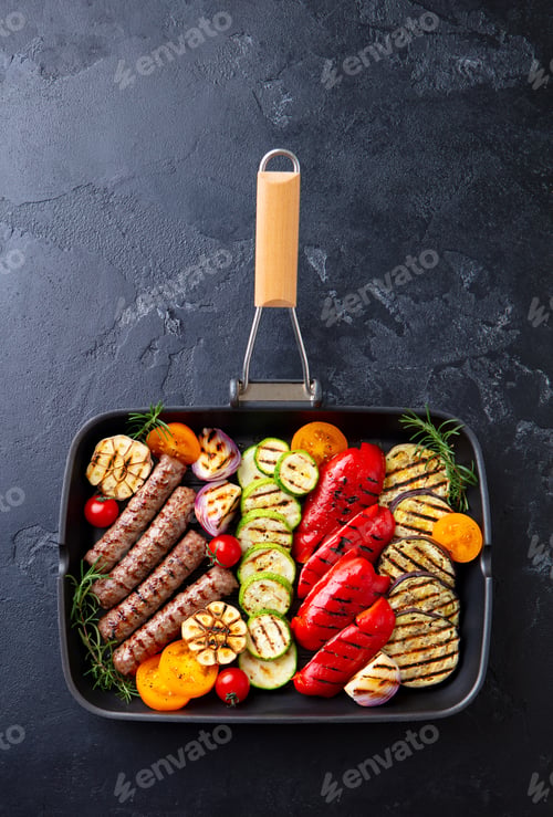 Preview: Grilled Meat Kebab and Vegetables in Grill Pan. Black Stone Background. Top view.