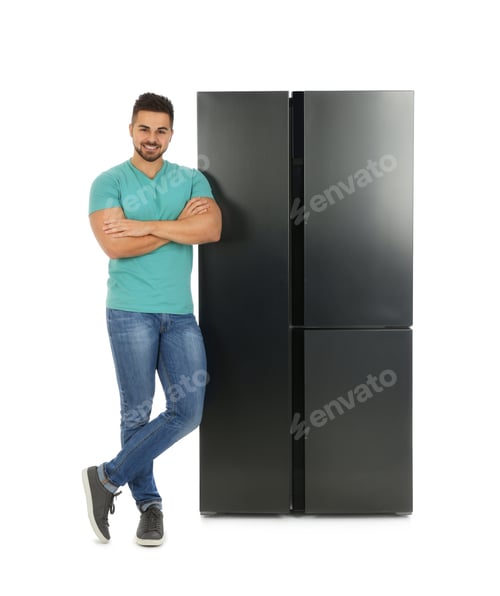 Preview: Young man near refrigerator on white background