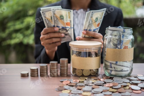 Preview: business finance. save money for investment concept money in the glass