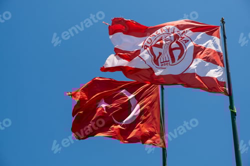 Preview: Striking Flags Waving Against Clear Blue Sky Backdrop