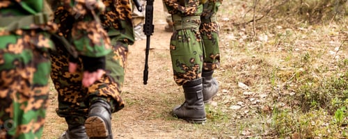 Preview: Rear view russian soldiers men gone on road military camouflage uniform