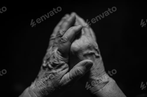 Preview: Close up of wrinkled hands, black and white.
