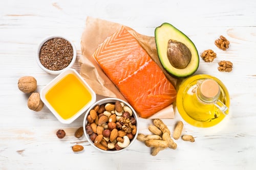 Preview: Healthy fats products at black background.