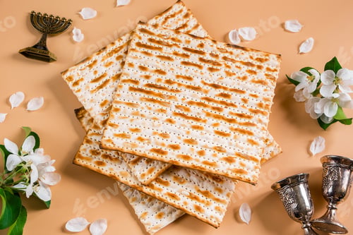 Preview: Happy Passover. Traditional Jewish holiday. Silver wine cups, spring flowers and matzo bread