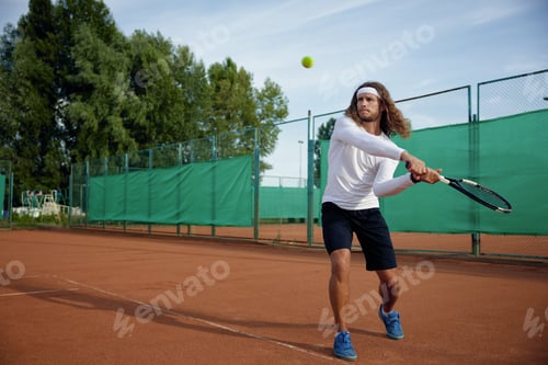 Preview: Professional tennis player playing game on outside hard court