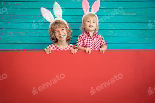 Preview: Smiling Children with Bunny Ears Holding Red Sign