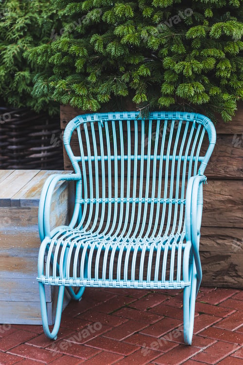 Preview: Design vintage furniture of the restaurant outdoor. Blue wicker chair and wooden table