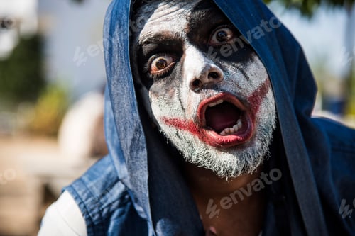 Preview: Close-up portrait of a horrible scary zombie man. Horror. Halloween.