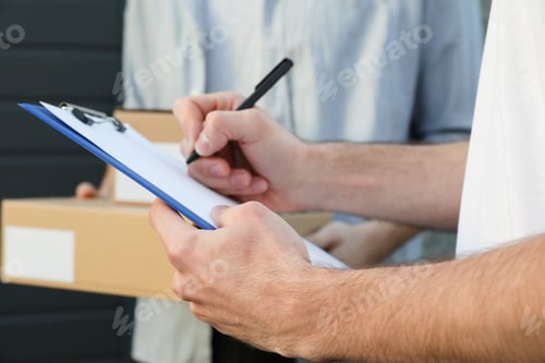 Preview: Man with boxes and delivery man outdoor, blank space