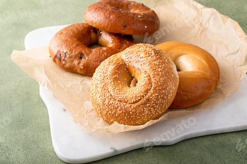 Preview: Delicious Assortment of Bagels on Rustic Background
