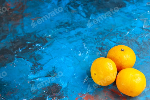 Preview: front view fresh tangerines on blue desk color citrus fruit photo juice tree ripe