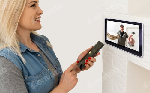 Preview: Woman watching delivery man on security camera cctv video on tablet