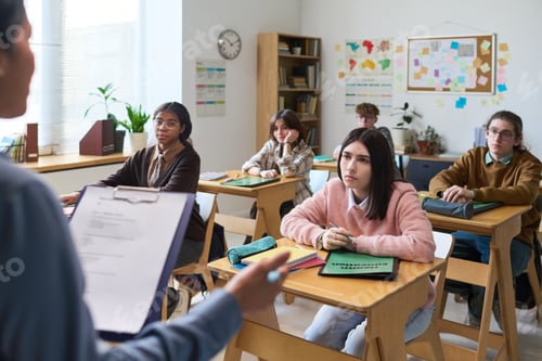 Preview: Engaged Students Listening Attentively in Classroom Setting