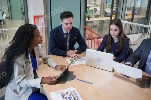 Preview: Diverse business people having a meeting