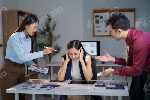 Preview: Stressed businesswoman having headache while colleagues arguing in office meeting