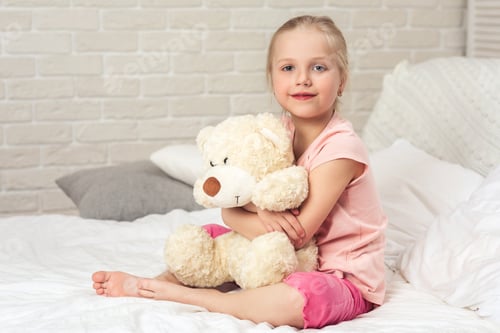 Preview: baby hugging a teddy bear