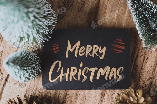 Preview: Top view of Merry Christmas and happy new year on blackboard with xmas tree