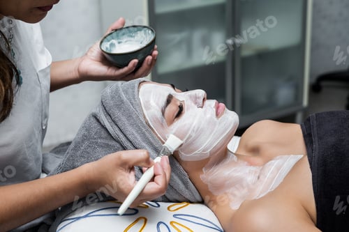Preview: Woman having facial mask in salon