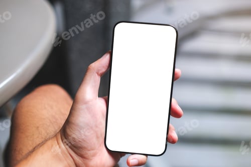 Preview: Mockup image of a man holding mobile phone with blank white screen in cafe