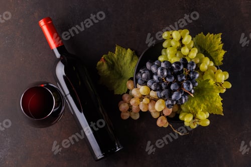 Preview: Red wine bottle and fresh grapes