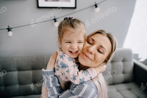 Loving Mother Embraces Child in Casual Indoor Setting