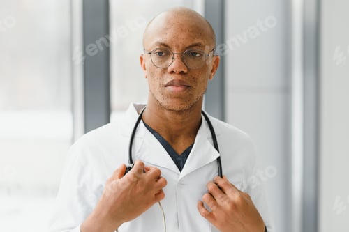 Preview: young male african doctor in hospital.